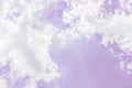 Fluffy white clouds on a pink background