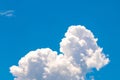 Fluffy, white, peaceful Cumulus Himilis clouds in a blue sky