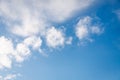 Fluffy white small clouds on the clear blue color sky background Royalty Free Stock Photo