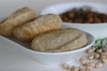 Fluffy whole wheat fried Indian flat bread, served along with Spicy chickpea gravy. Locally known as Chole puri