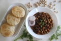 Fluffy whole wheat fried Indian flat bread, served along with Spicy chickpea gravy. Locally known as Chole puri