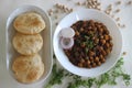 Fluffy whole wheat fried Indian flat bread, served along with Spicy chickpea gravy. Locally known as Chole puri