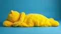 Fluffy yellow sleeping bag on soft blue blanket against a blue wall , texture, cozy Royalty Free Stock Photo