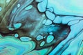 Fluid Art. Blue, green and black swirls. Abstract marble background or texture