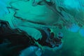 Fluid Art. Metallic Green and blue abstract waves with golden particles on black background. Marble effect background or Royalty Free Stock Photo