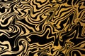 Fluid art. Modern artwork golden and black background. Mixture of acrylic paints. Abstract liquid painting marble