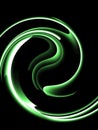 Fluorescent green swirl pattern on black background Royalty Free Stock Photo