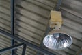 Fluorescent lamp hanging on the roof inside the warehouse