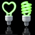 Fluorescent lamps, spiral shaped, heart shaped, green glow, 3d rendering on dark background Royalty Free Stock Photo