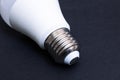 Fluorescent light bulb base on black background Royalty Free Stock Photo