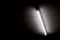 Fluorescent light tube on the wall Royalty Free Stock Photo