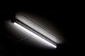 Fluorescent light tube on the wall Royalty Free Stock Photo