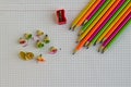 Fluorescent,neon color lead pencils on the checked paper background Royalty Free Stock Photo