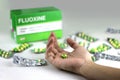 Fluoxetine capsules on a hand Royalty Free Stock Photo