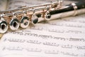 Flute across a musical score Royalty Free Stock Photo