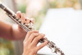 Flute :  A closeup of hands of a musician playing the flute, detail shot, classical music, wind instrument performance player up Royalty Free Stock Photo
