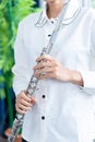 Flute :  A closeup of hands of a musician playing the flute, detail shot, classical music, wind instrument performance player up Royalty Free Stock Photo