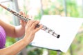 Flute :  A closeup of hands of a musician playing the flute, detail shot, classical music, wind instrument performance player up Royalty Free Stock Photo