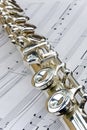 Flute lay across sheet music Royalty Free Stock Photo