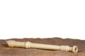 Flute lie on the burlap fabric isolated on a white background