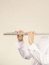 Flute music instrument in hands of flutist musician Royalty Free Stock Photo