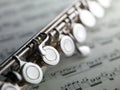 Flute on musical score Royalty Free Stock Photo