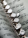 Flute on musical score Royalty Free Stock Photo