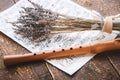 Flute with notes and lavender on the wooden table horizontal Royalty Free Stock Photo