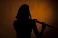 Flute Player girl Teenage Silhouette on Yellow Royalty Free Stock Photo