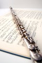 A flute on sheet music Royalty Free Stock Photo