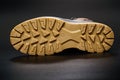 fluted sole of winter brown leather men's shoes on a black background. Royalty Free Stock Photo