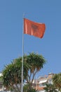 Fluttering Albanian flag blue sky in background