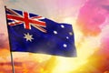 Fluttering Australia flag on beautiful colorful sunset or sunrise background. Success concept