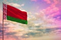 Fluttering Belarus flag mockup with the space for your content on colorful cloudy sky background