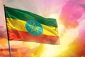 Fluttering Ethiopia flag on beautiful colorful sunset or sunrise background. Success concept