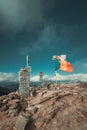 Fluttering flags on top of the mountains in the summer time Royalty Free Stock Photo