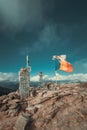 Fluttering flags on top of the mountains in summer time Royalty Free Stock Photo