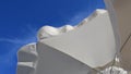 White textile beach umbrellas against clear blue sky with spindrift clouds Royalty Free Stock Photo