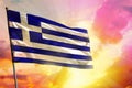 Fluttering Greece flag on beautiful colorful sunset or sunrise background. Success concept Royalty Free Stock Photo