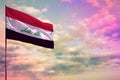 Fluttering Iraq flag mockup with the space for your content on colorful cloudy sky background