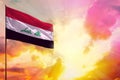 Fluttering Iraq flag in top left corner mockup with the space for your text on beautiful colorful sunset or sunrise background