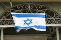 Waving Israeli flag old building, Tel Aviv Royalty Free Stock Photo