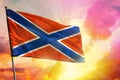 Fluttering Novorossiya flag on beautiful colorful sunset or sunrise background. Success concept