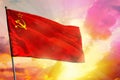 Fluttering Soviet Union SSSR, USSR flag on beautiful colorful sunset or sunrise background. Success concept