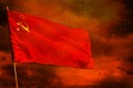 Fluttering Soviet Union SSSR, USSR flag on crimson red sky with smoke pillars background. Troubles concept