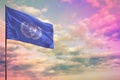 Fluttering United Nations flag mockup with the space for your content on colorful cloudy sky background