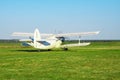 Fly airplane on green grass and blue sky clear background selective focus Royalty Free Stock Photo