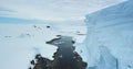 Fly in beautiful glacier canyon frozen ocean bay