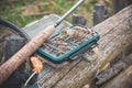 Fly box and rod on the river bank. Fly fishing Royalty Free Stock Photo