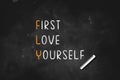 FLY - First Love Yourself written on black board with chalk  vector illustration Royalty Free Stock Photo